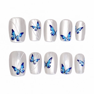 Handmade press-on nails with blue butterfly patterns and silver cat-eye finish