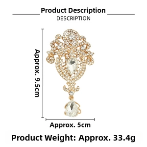 Macro detail of luxury waterdrop brooch with sparkling crystals and gold-plated alloy
