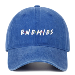 Detailed embroidery of ENEMIES text with colorful dots on washed denim baseball cap