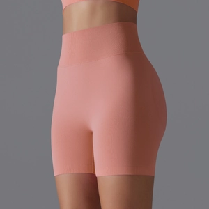 Detail view of the ribbed high waistband and seamless compression fabric on yoga shorts