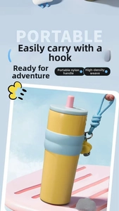 Detail of high-density nylon woven portable handle with cute yellow chick charm