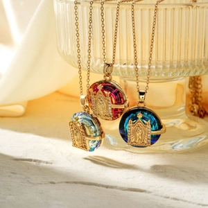 Elegant gold stainless steel necklace featuring colorful crystal pendants with religious relief