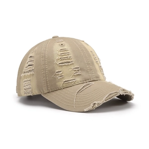 Vintage khaki distressed baseball cap with ripped details and frayed edges for streetwear