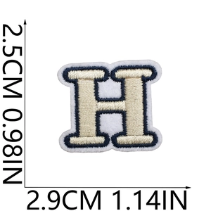 Detailed view of cream and navy embroidered letter H patch with 2.5cm size dimensions