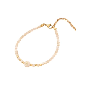 Beaded shell bracelet in light pink and gold with a round letter B charm and clasp