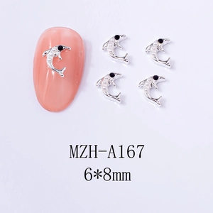Macro detail of 6x8mm silver dolphin nail art charms with white pearls on pink nails