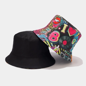 Detail of reversible bucket hat showing classic black and 90s pop art graffiti patterns