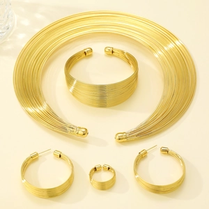 Chunky gold multi-layer choker necklace with matching cuff bracelet and hoop earrings set