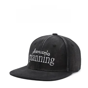 Close-up of Scenario Planning white embroidery on high-quality black twill baseball cap