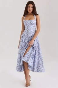 Detail of the light blue floral halter neck maxi dress with decorative buttons