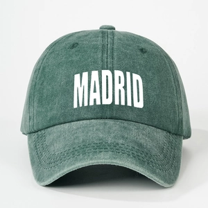 Vintage dark green washed cotton baseball cap featuring Madrid print with adjustable strap