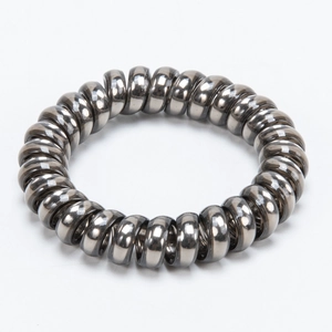 Metallic dark grey spiral hair tie with a glossy finish for women's hairstyles