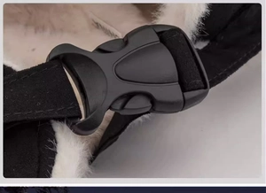 Detailed macro view of the black plastic buckle and white faux fur lining on a winter hat