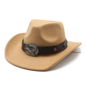 Close-up of camel felt cowboy hat with leather band and metal eagle ornament detail