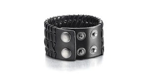 Close-up of black leather punk bracelet featuring woven texture and metallic snap buttons