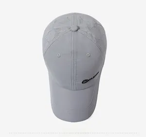 Detail showing laser-cut ventilation holes and SOFASHION embroidery on light gray cap