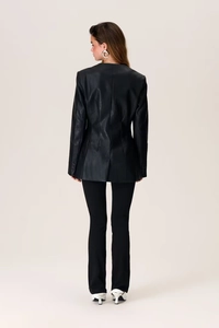 Detailed back view of a slim-fit black faux leather blazer jacket for women