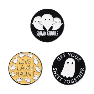 Three creative Halloween enamel pins with funny ghost puns on white background