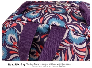 Detailed close-up of precise stitching and dual metal zippers on purple floral backpack