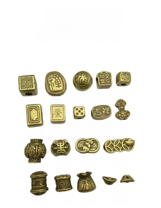 Close-up of assorted antique bronze ethnic beads and pendants for DIY jewelry making