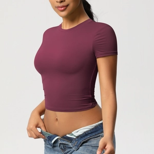 Close-up of slim-fit wine red yoga crop top made from breathable quick-dry elastic fabric