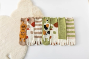Close-up of fluffy coral fleece cat socks set with adorable paw patterns in seven colors