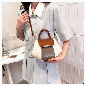 Detail of multi-color crossbody bag with top handle and FASHION & BAGS lettering