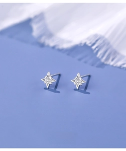 Macro shot of S925 silver star stud earrings with micro-set cubic zirconia stones