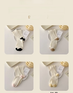 Detailed knit texture of rib-knit cotton socks in black, khaki, pink and yellow