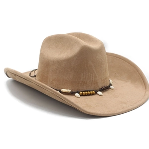 Detailed view of camel suede cowboy hat with ethnic beads and seashell decorative band
