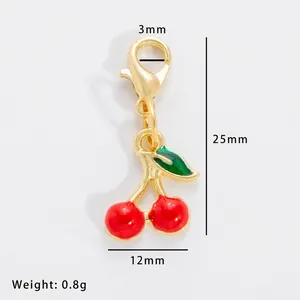 Detail of red cherry enamel charm with gold lobster clasp and size measurements