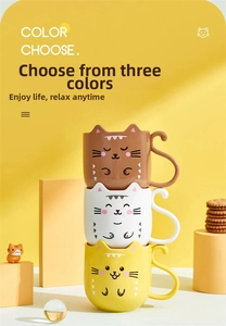 Detail of cute cat-shaped mugs featuring unique curled tail handles in three colors