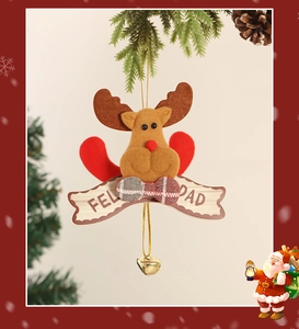 Detail of fabric reindeer ornament with red bow and Merry Christmas sign with bell