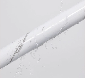 Close-up of waterproof self-adhesive kitchen sticker with water splashing on the surface