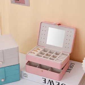 Premium pink jewelry box with double-layer velvet interior, mirror, and elegant clasp closure