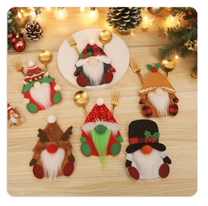 Set of 6 Christmas gnome cutlery holders with sequin hats on a festive wooden table