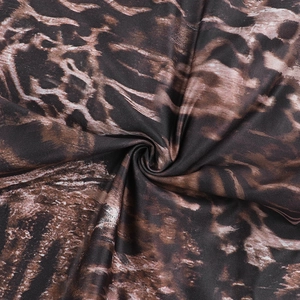 Close-up of the leopard print fabric texture showing detailed weave and pattern
