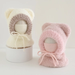 Detail of plush winter hooded scarf hats with bear ears and soft ribbed lining
