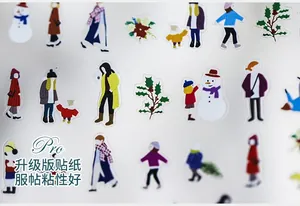Detail of winter theme nail stickers featuring fashion illustrations and snowmen motifs