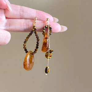 Asymmetric resin drop earrings with tiger eye beads and gold chain tassels