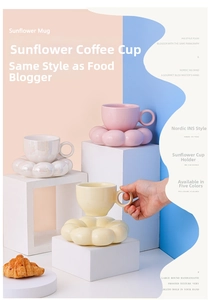 Modern macaron ceramic coffee cups and sunflower saucers in pastel pink and yellow