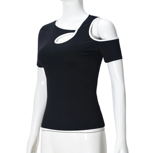 Close-up of black slim fit top with white contrast edging and trendy shoulder cutouts
