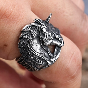 Macro shot of retro unicorn ring showing detailed mane textures and spiral horn