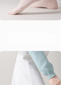 Close-up of light pink silk socks featuring breathable mesh texture and elastic cuffs
