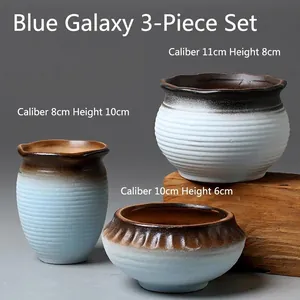Three-piece ceramic succulent planter set in blue and cream with horizontal texture