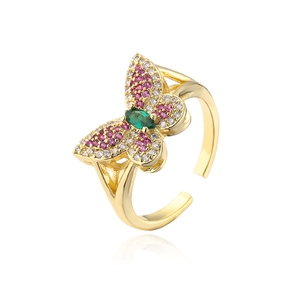 Close-up of 18K gold butterfly ring with colorful pink, white and green zircon stones