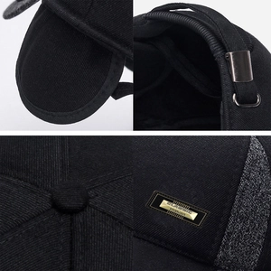 Detail of winter baseball cap with ear flaps featuring classic fashion metal plaque