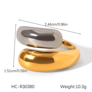 Detailed close-up showing dimensions of two-tone gold and silver flower steel ring