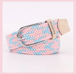 Detail of blue and pink woven elastic belt with silver buckle and leather tip finish