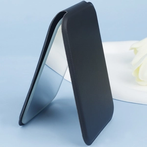 Detail of portable foldable makeup mirror with premium black PU leather case and stand